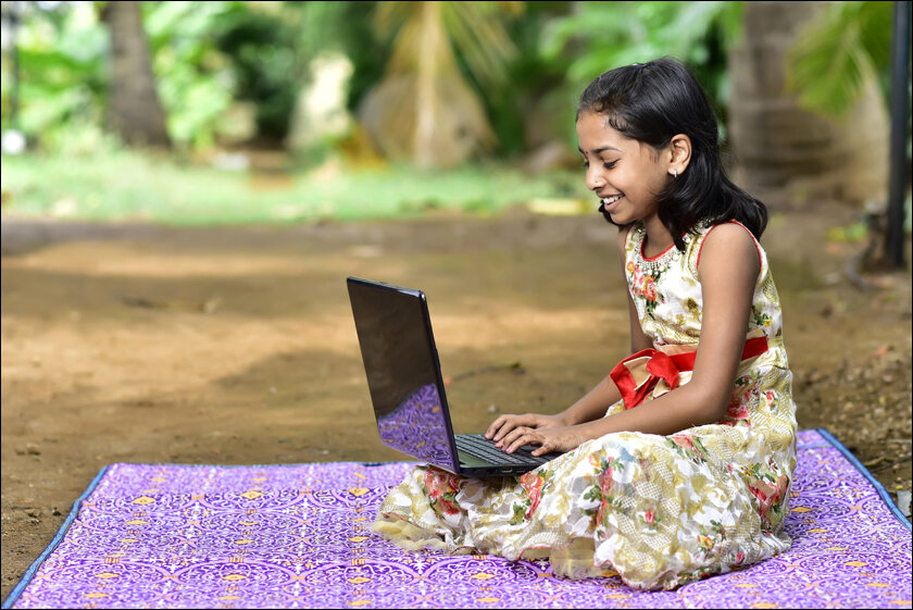 village girl using laptop